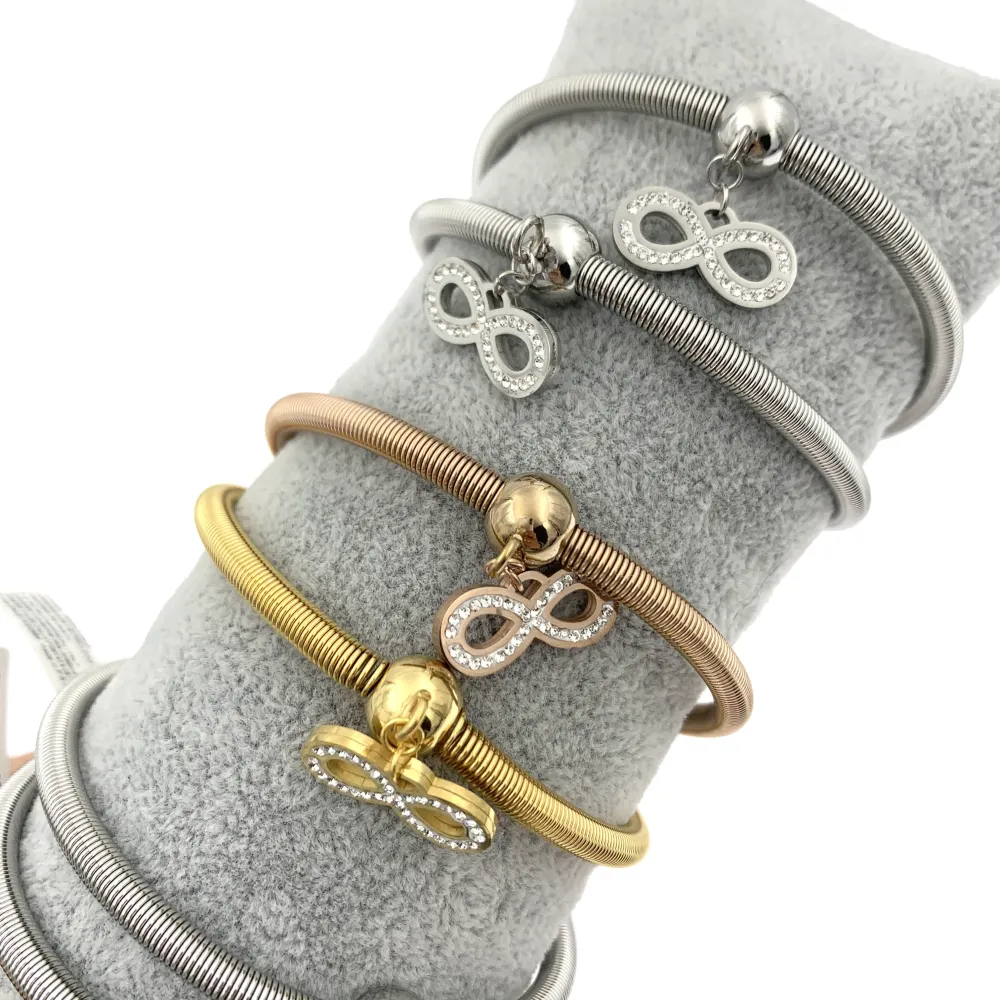 12Pz Bracciali Elastici in Acciaio+Cuscino in Omaggio - BPA7667-Mix Con Strass-12 Pz Bracciali in Acciaio